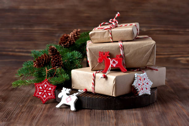 istock Holiday background with gift boxes on wooden surface. Christmas concept. 1279527607