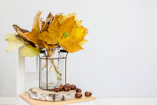 istock Autumn decorations with chestnut and maple leaves 1279528636