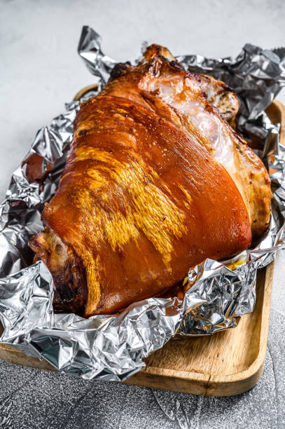 istock Roast pork knuckle with pepper and spices. Gray background. Top view 1279528661