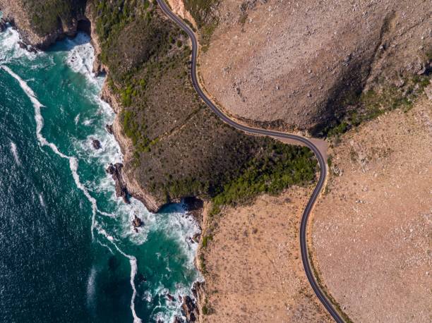 istock Aerial view over a winding coastal road 1279528994