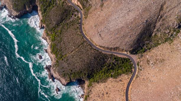 istock Road along a rugged coastline 1279529004