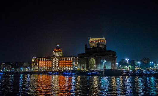 Beautiful Gateway of India near Taj Palace hotel on the Mumbai harbour with many jetties on Arabian sea near Chhatrapati Shivaji monument