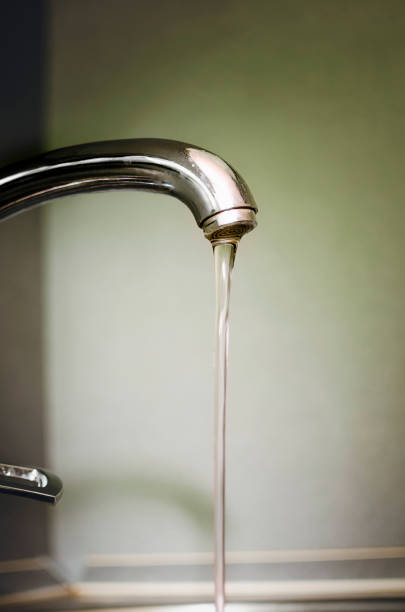 istock Water flows from the tap. Water supply. 1279529075