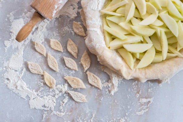 istock Apple pie in the process of being made 1279531396