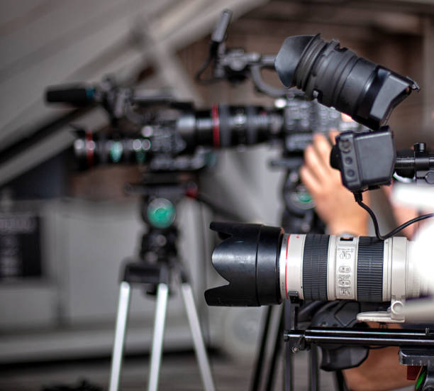 istock digital television camera filming a symphony orchestra. 1279532640