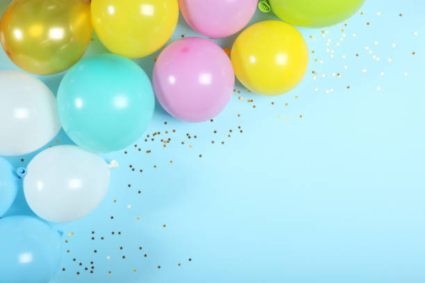 istock balloons in color top view. Festive background with place for text. 1279534551