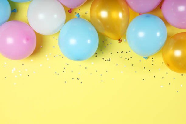 istock balloons in color top view. Festive background with place for text. 1279534564