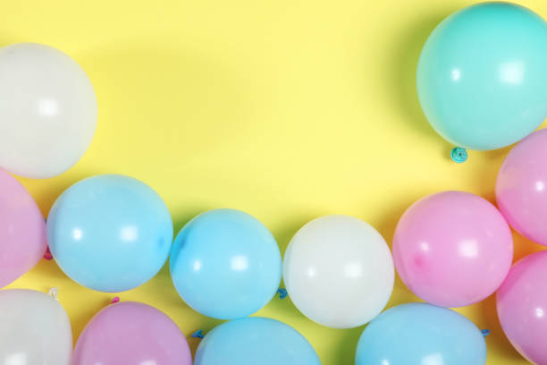 istock balloons in color top view. Festive background with place for text. 1279534706