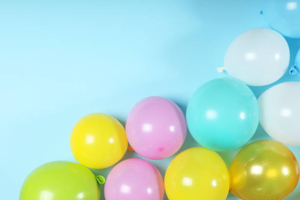 istock balloons in color top view. Festive background with place for text. 1279534818