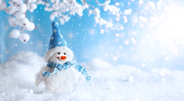 istock Funny Snowman on winter snowy background with snowy branches 1279535089