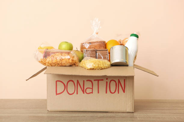 istock boxes with donations with the necessary things on the table. Charity, volunteering. 1279536245
