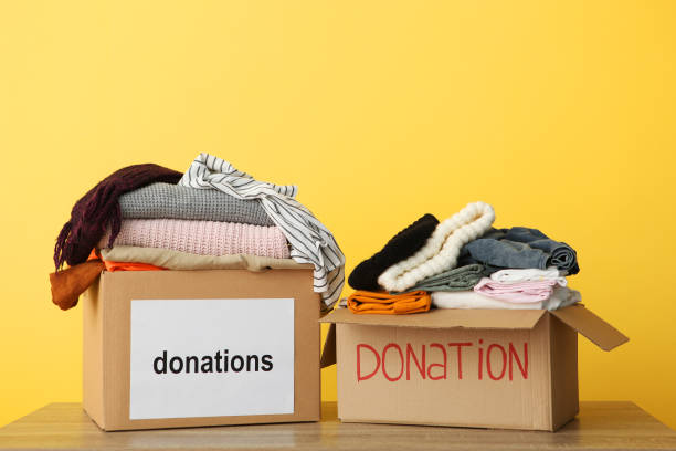 istock boxes with donations with the necessary things on the table. Charity, volunteering. 1279536307