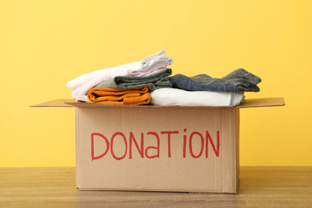 istock boxes with donations with the necessary things on the table. Charity, volunteering. 1279536321