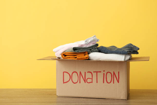 istock boxes with donations with the necessary things on the table. Charity, volunteering. 1279536394