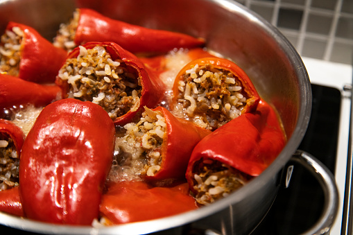 Cooking red paprika stuffed with the minced meat