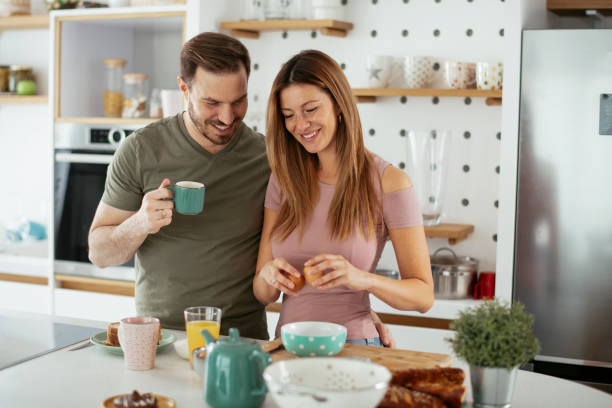 istock Young couple making breakfast at home. 1279540408