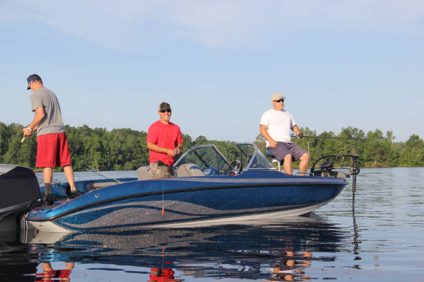 istock Three men in a blue boat, fishing 1. 1279541298