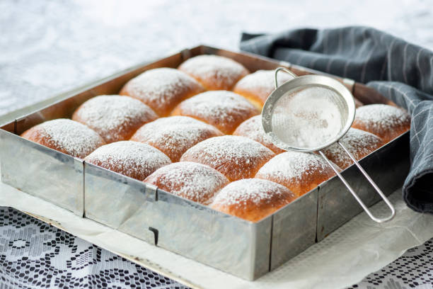istock Sweet bread rolls with powdered sugar on top 1279541441
