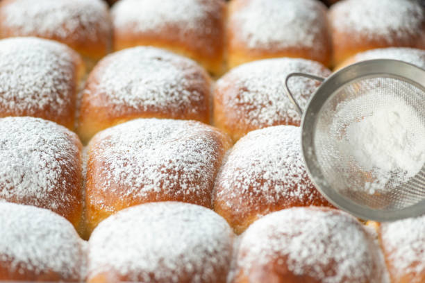 istock Sweet bread rolls with powdered sugar on top 1279541456
