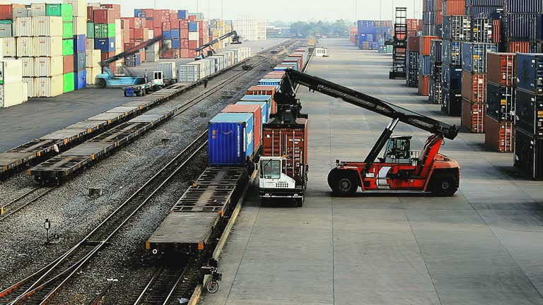 Container train timelapse working in container yard, used in industrial import-export or rail transport applications