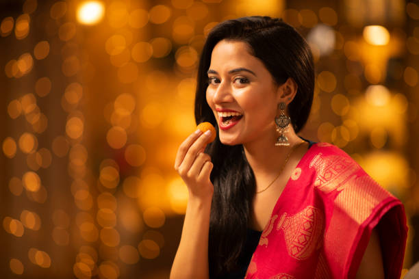 Young woman Diwali celebrate at home - stock photo Indian, Indian culture, festival, ethnicity, woman, adult, Diwali, india sweets stock pictures, royalty-free photos & images