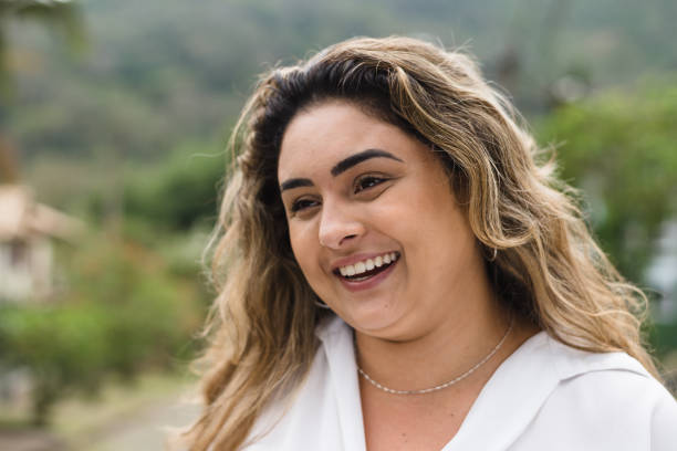 istock Smiling woman outdoors 1279553443