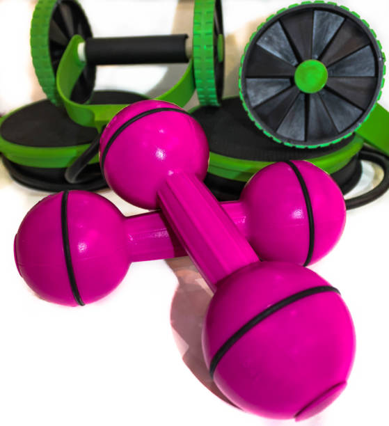 istock Fitness equipment, pink hand weights on white background 1279554278