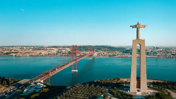 Photo of Aerial view of Sanctuary of Christ the King, Santuario de Cristo Rei in Portugal. Aerial drone photo of Catholic monument. Lisbon city sightseeing