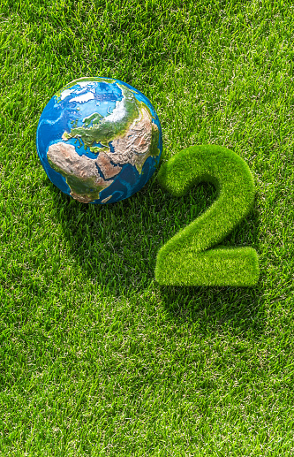 Oxygen formula consisting of grassy green numbers on green grass. Conceptual image of caring for the balance of the global ecosystem guarantees the natural production of the oxygen we breathe. \nVisual references from NASA (https://visibleearth.nasa.gov/images/74117/august-blue-marble-next-generation).