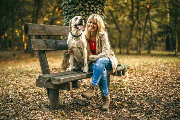 istock woman walking with her dog 1279561710