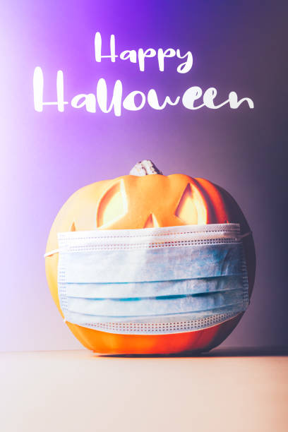 istock Halloween Jack o Lantern in medical mask 1279564250