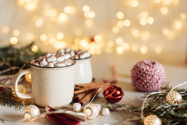 istock Mug for mockup near christmas tree and gift boxes 1279564327