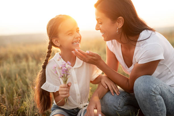 istock Mother and daughter having fun in countryside 1279564465