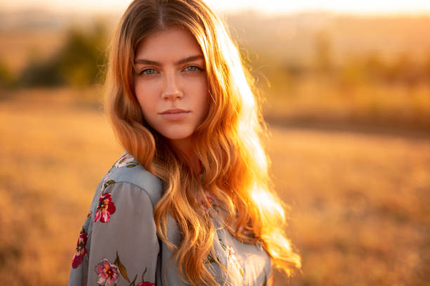 istock Calm young woman standing in field 1279564474