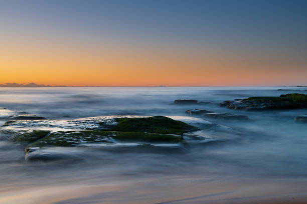 istock Clear skies and soft seas, dawn at the beach 1279565570