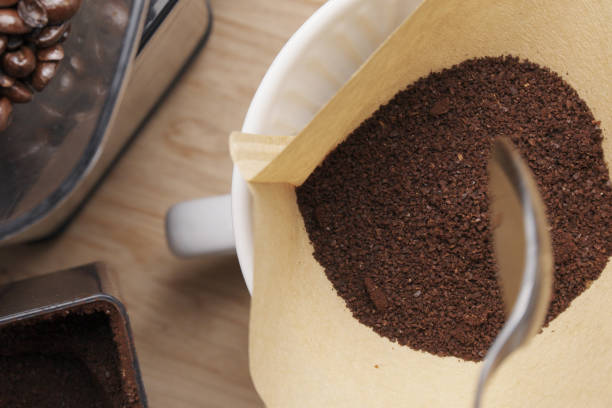 Scooping Coffee into Pour Over Filter stock photo