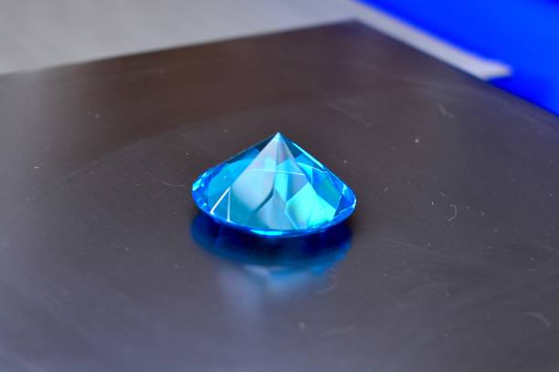 istock Blue crystal rhine stone on a dark surface 1279575813