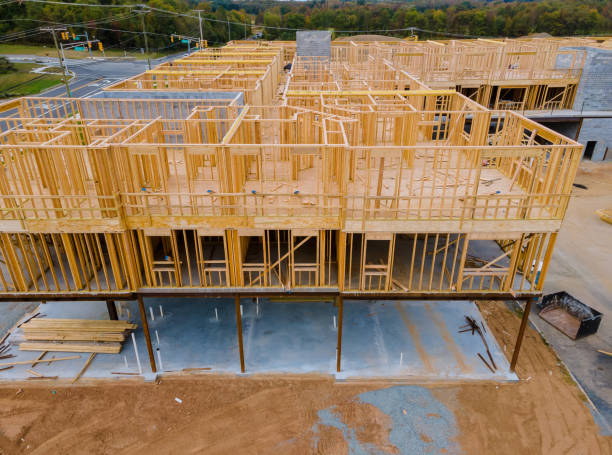 istock Framing home unfinished wood frame building or a house 1279576415