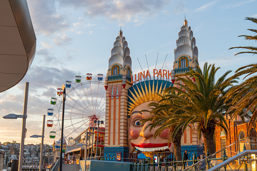 Valencia, Spain - July 8, 2021: Low angle view of ferris wheel in summer amusement park. Every year one is set at the Turia Garden so children can enjoy their holidays