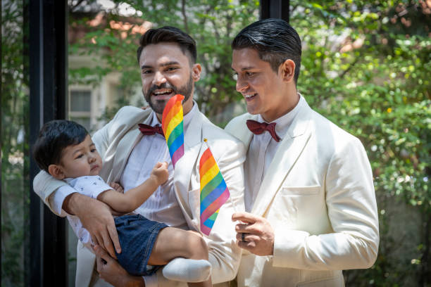 gay couple family with adopted son - smoking family smoking issues child imagens e fotografias de stock