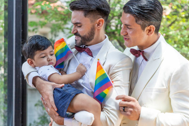 gay couple family with adopted son - smoking family smoking issues child imagens e fotografias de stock