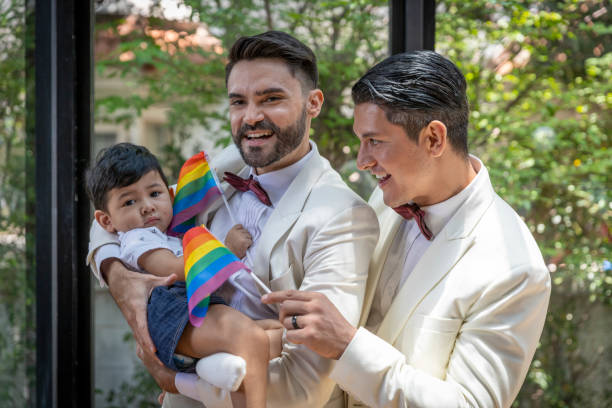 gay couple family with adopted son - smoking family smoking issues child imagens e fotografias de stock