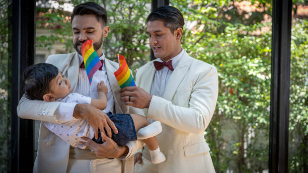 gay couple family with adopted son - smoking family smoking issues child imagens e fotografias de stock