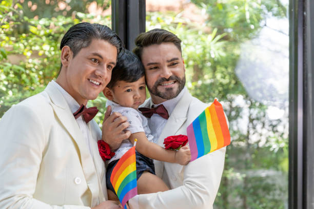 gay couple family with adopted son - smoking family smoking issues child imagens e fotografias de stock