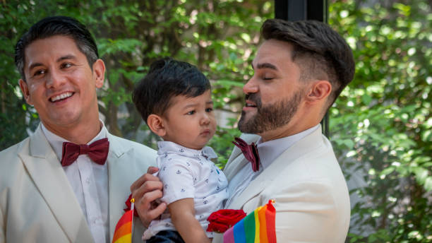 gay couple family with adopted son - smoking family smoking issues child imagens e fotografias de stock