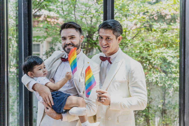 gay couple family with adopted son - smoking family smoking issues child imagens e fotografias de stock