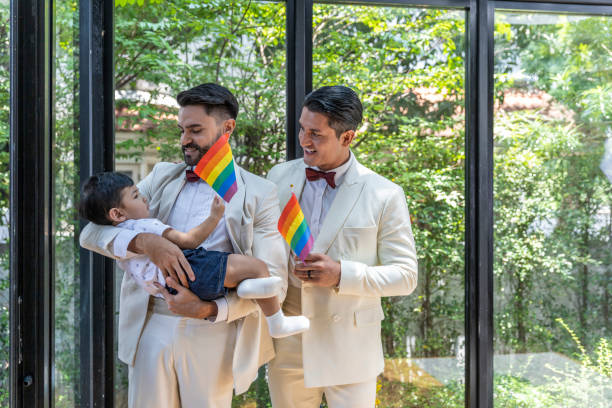 gay couple family with adopted son - smoking family smoking issues child imagens e fotografias de stock