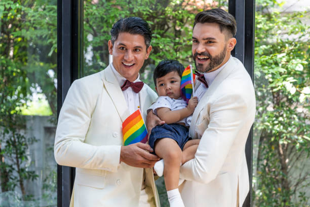 gay couple family with adopted son - smoking family smoking issues child imagens e fotografias de stock