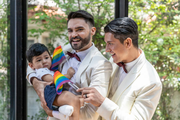 gay couple family with adopted son - smoking family smoking issues child imagens e fotografias de stock