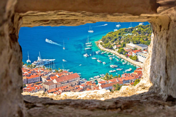 istock Hvar bay aerial view through stone window 1279580588